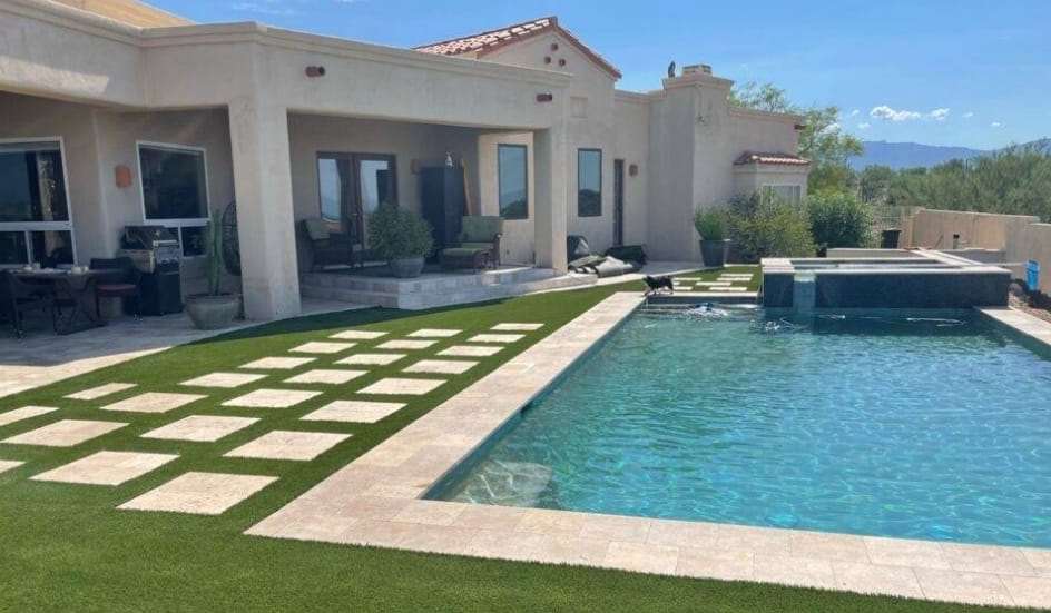 Artificial turf surrounding swimming pool